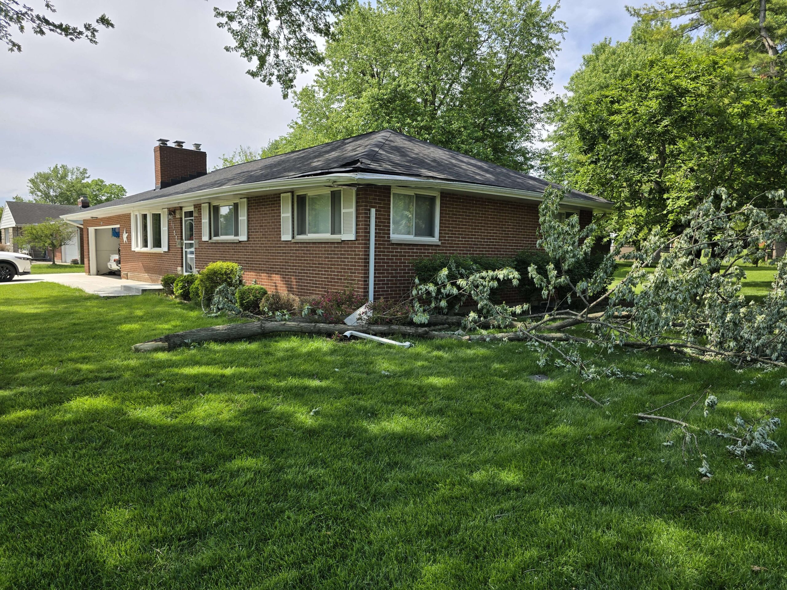 Before: storm damage to roof and soffit